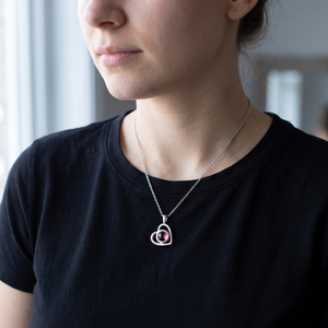 Silver Hidden Photo Necklace worn with a black t-shirt in morning light
